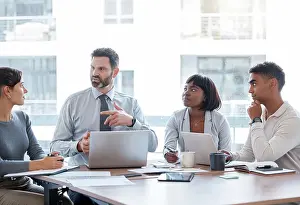 Meet Prints: Business, people and discussion in office with laptop
