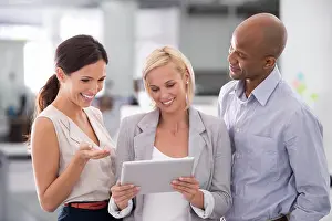 Diverse Prints: Business people, group and reading research on tablet with smile for corporate planning