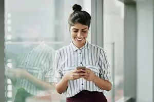 Cellphone Prints: Business woman, smile and phone text with happiness at office window with a email