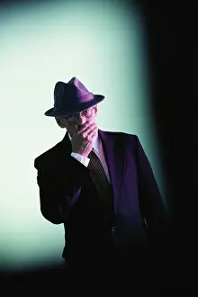 Speak Prints: Businessman covering his mouth with his hand