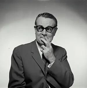 Business Suit Prints: Businessman with his fingers on his lips