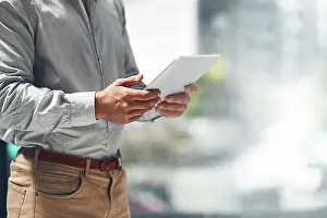 Analyst Prints: Businessman, hands and browsing with tablet for news