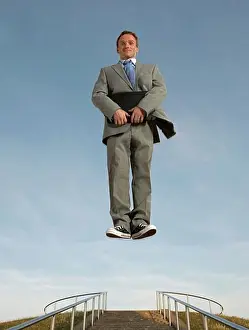Notebook Prints: Businessman hovering above the ground