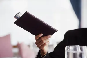 Bill Prints: Businessman paying the check at restaurant