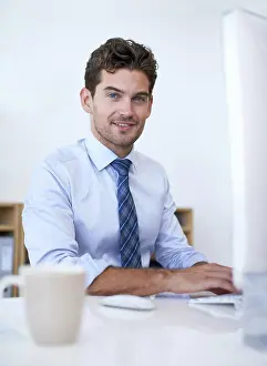 Search Prints: Businessman, portrait and smile at computer in office for as online researcher