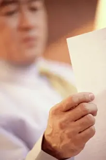Shirt And Tie Prints: Businessman reading a sheet of paper