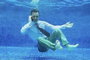 Determined Prints: Businessman underwater