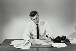 Paperwork Prints: Businessman working in an office