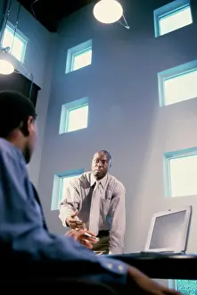 Meet Prints: Two businessmen talking in an office