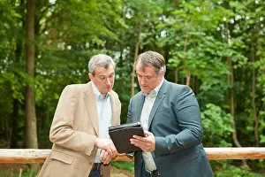 Networks Prints: Businessmen using tablet computer