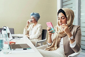 Bame Prints: Businesswoman in office, using phone