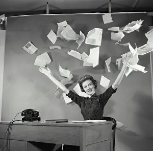 Paperwork Prints: Businesswoman throwing papers in office
