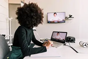 Sweater Prints: Businesswoman on video call in office