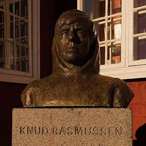 Geography Prints: Bust of Knud Rasmussen in front of his birthplace