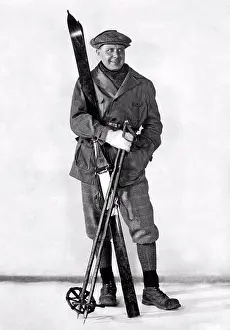 Recreation Prints: c. 1910 A man poses in fashionable ski wear with his skis and poles