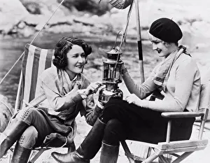 Unitedstates Prints: California: c. 1928 Actresses Dorothy Sebastian (L) and Josephine Dunn (R) light a lantern on a camping trip