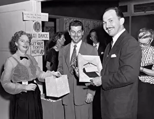 Medium Group Of People Prints: California: c. 1950 People buying tickets for a taxi dance benefit for the March of Dimes