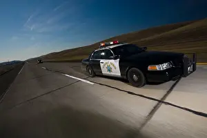 Afternoon Prints: California Highway Patrol ( CHP ) Ford Crown Victoria police car driving on rural California highway