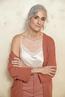 Positive Emotion Prints: Calmly, a middle-aged woman with gray hair looks into camera