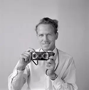 Focusing Prints: Camera history. A man with a Kodak Stereo Camera