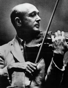 1949 Prints: Camera In The Stringe -- Violinist Josef Szigeti during rehearsal with the Philadelphia orchestra