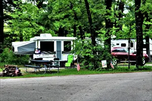 Wisconsin Prints: A camper is set up at a campsite May 26