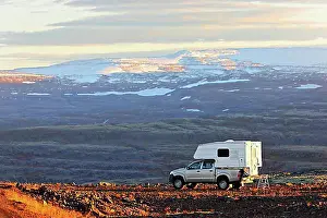 Evening Atmosphere Prints: Camper Van parked in volcanic landscape, Westfjoerds, Iceland, Europe