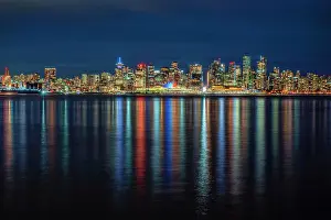 Vancouver Prints: Canada, British Columbia, Vancouver. Downtown reflections in ocean at night