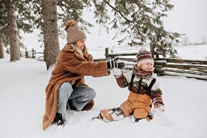 Preschool Age Prints: Canada, Ontario, Mother and daughter playing in snow