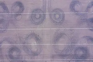 Drift Prints: Car drift skid marks on empty parking lot, aerial drone top view