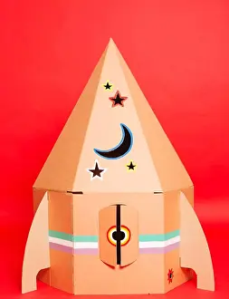 Departure Prints: Cardboard space rocket. Concept image