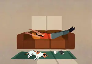 Laying Prints: Carefree woman stretching on sofa in sunny living room