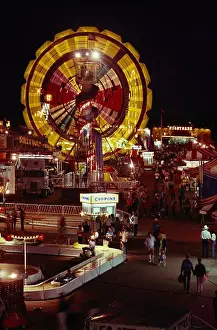 Lighthearted Prints: Carnival rides at twilight at Cheyenne Frontier Days in Cheyenne, WY. - CF65640