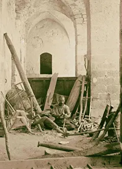 Carpenter Prints: A carpenter making plows and farm implements. 1920 Israel