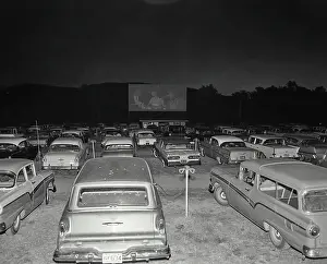 Theater Prints: Cars parked in an drive-in movie theater