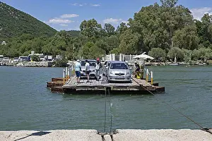Natural Preserve Prints: Cars on primitive cable ferry crossing the Vivari Channel near Butrint National Park