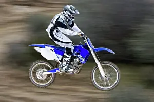 Athletes Prints: Catching air on a motorcross bike (motion blur)