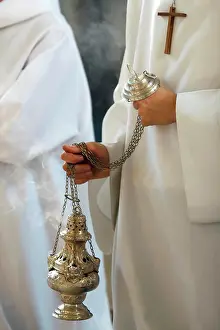 Incense Prints: Catholic church. Altar boy shaking a censer to produce smoke and fragrance of incense