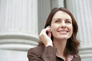 Conversation Prints: Caucasian businesswoman using cellular hands-free cellular device
