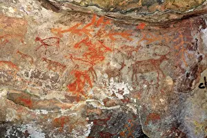 Frescoes Prints: Cave paintings showing animals on rock shelters no 12 ten thousands years old at Bhimbetka near Bhopal