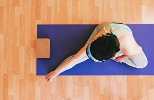 Physical Fitness Prints: Cenital Photo: Pregnant Woman Stretching her Right Leg