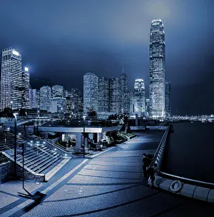Chinese Prints: Central and Western district promenade leads through to skyscrapers on Hong Kong island above Victoria Harbour at night