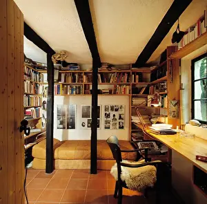 Beam Prints: Chair at pine desk in study bedroom with wall shelves above bed with leather cover