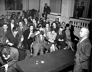 Composer Prints: Chaplin Talks - Reporters and cameramen crowd the floor of the hotel ballroom and are draped over the balcony
