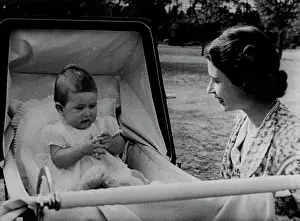 King Of Great Britain Prints: A charming study of Princess Elizabeth and Prince Charles at their delightful Surrey home
