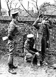 World War Two Prints: Check-Up : British Military police check up on a battle-happy hun captured by Montgomery's men in their drive