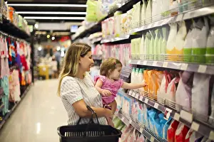 With Each Other Prints: Cheerful mother and baby spending time in shopping in shopping centre