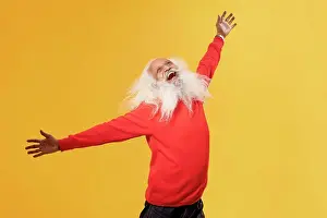 Senior Adult Prints: A CHEERFUL OLD MAN HAPPILY RAISING ARMS AND LOOKING ABOVE