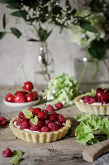 Dessert Prints: A cherry and raspberry tart on a kitchen table