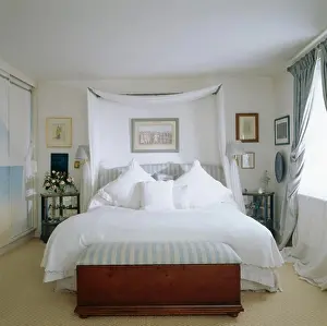 Pillows Prints: Chest below bed with white linen and drapes in white bedroom